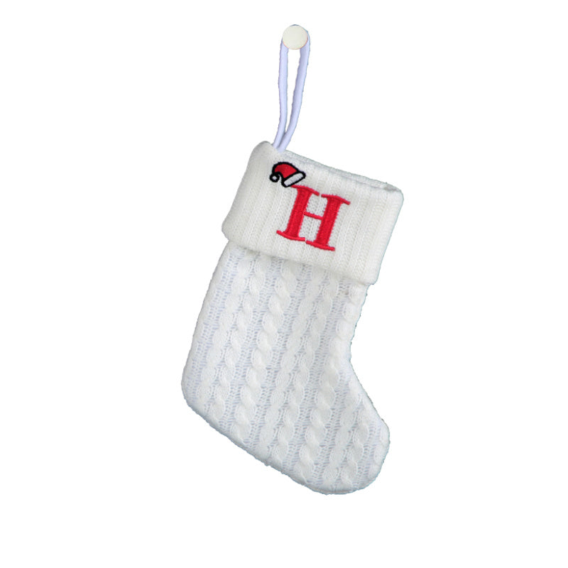 White cable knit stocking with embroidered 'F' - Ideal for indoor decor.