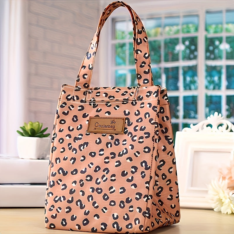 Get ready for your next picnic with this portable handheld lunch bag! Made from durable Oxford cloth and aluminum foil, this bag features a stylish leopard pattern and is perfect for keeping your food insulated. It's also a great gift idea for Christmas