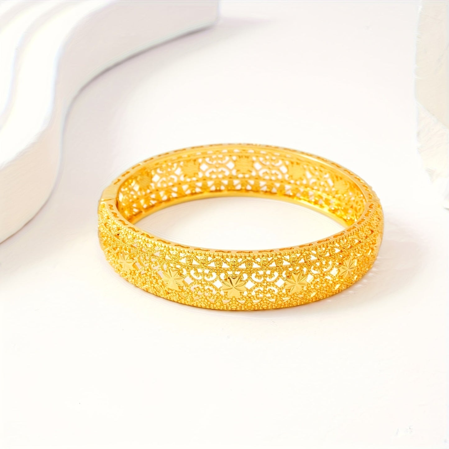 Two pieces of beautiful Golden Open Bracelet with Elegant Hollow Design, perfect for Middle Eastern and Saudi Arabian Festivals. An exquisite gift for women's fashion, ideal for Dubai brides. This hand ornament showcases European and American Ethnic