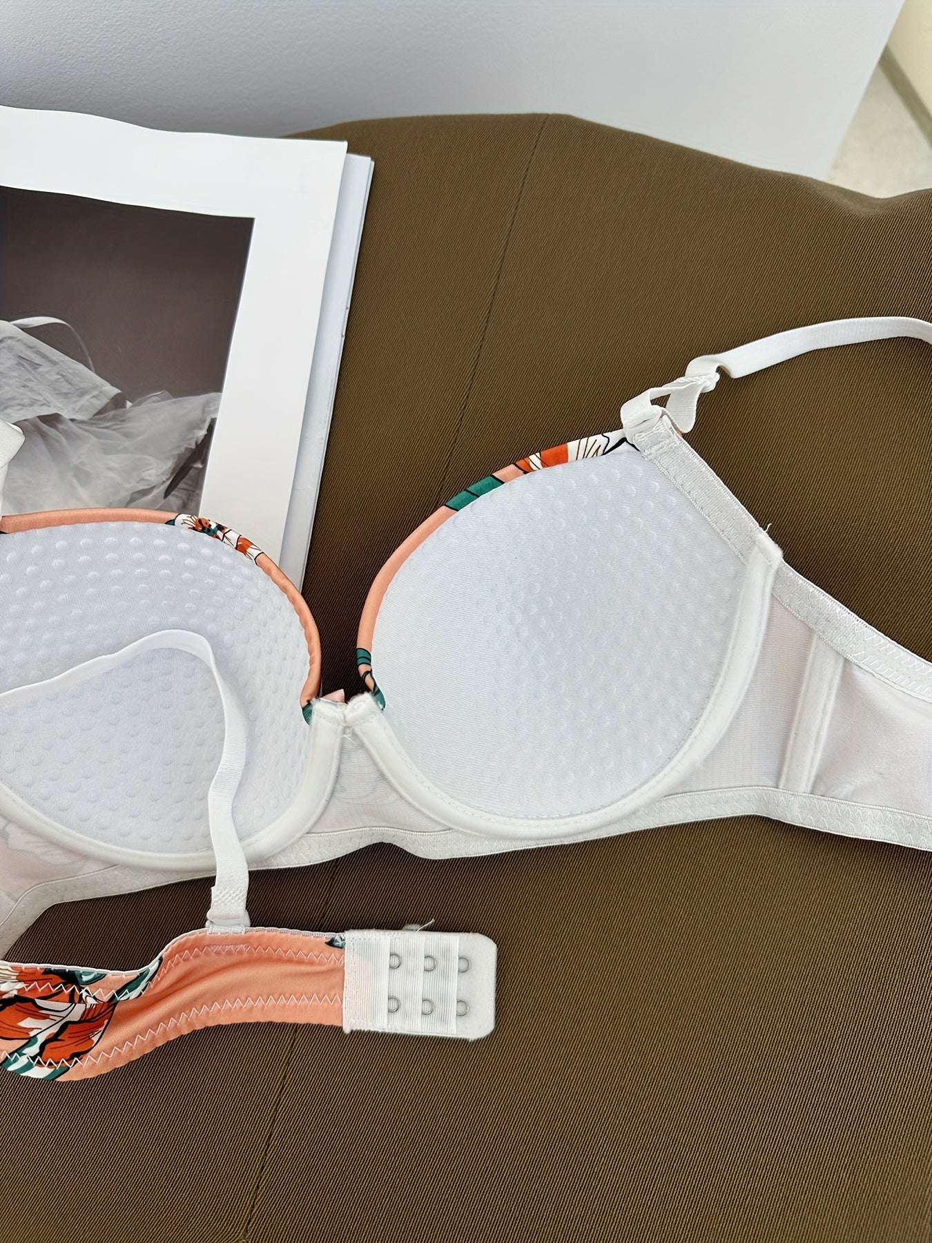 Floral bra and panty set with steel underwire and breast enhancement feature for women.