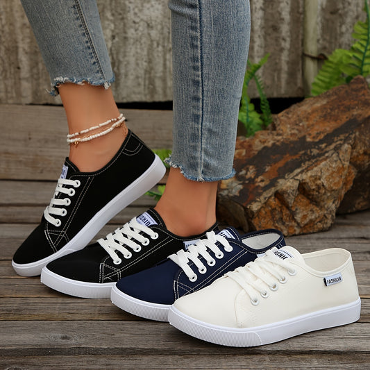 Black & white lace-up sneakers for women with round toe, low-top design, and comfortable EVA sole.