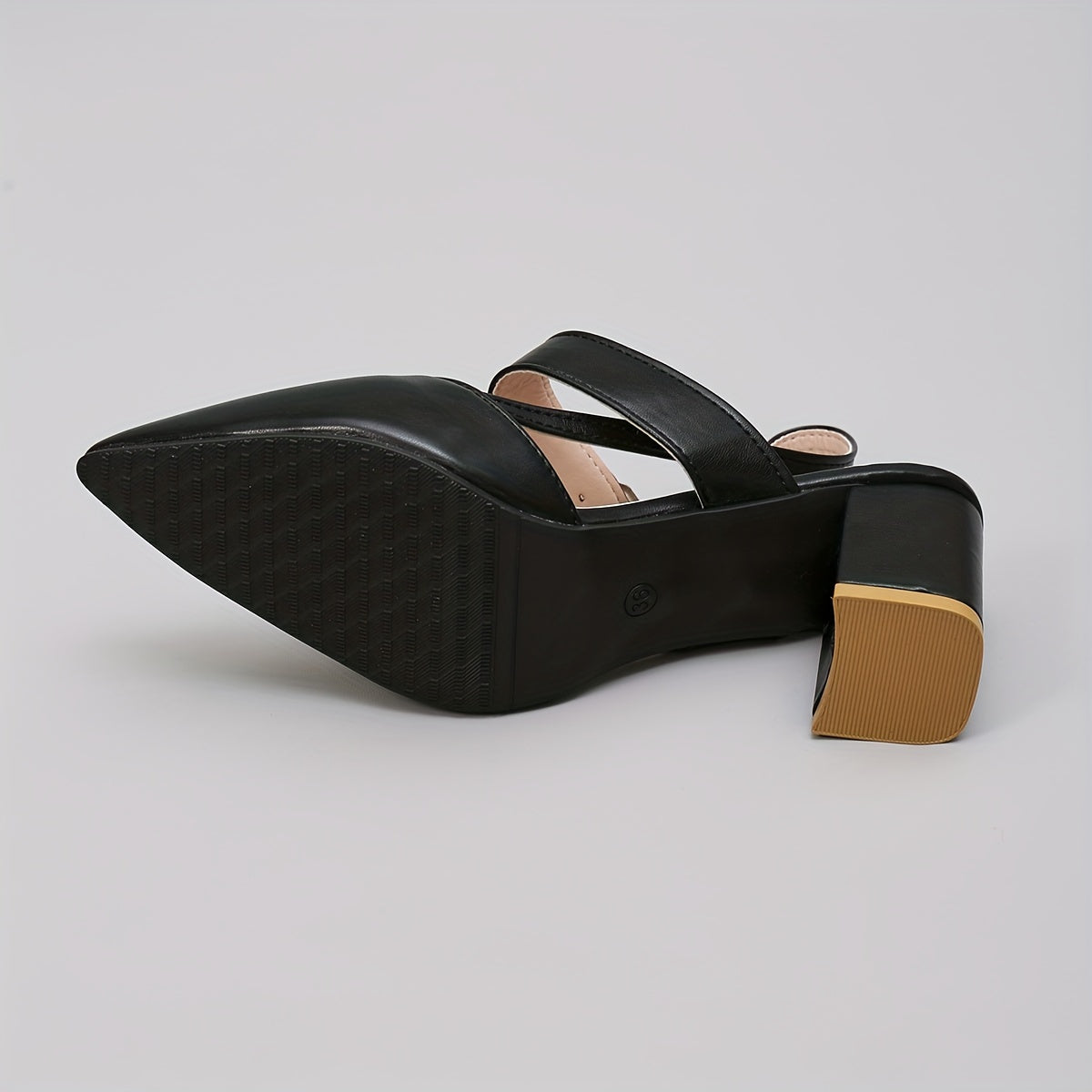 Women's black block heel sandals with pointed toe, slip-on style, and faux sole. Made from man-made materials, suitable for all-season fall footwear.