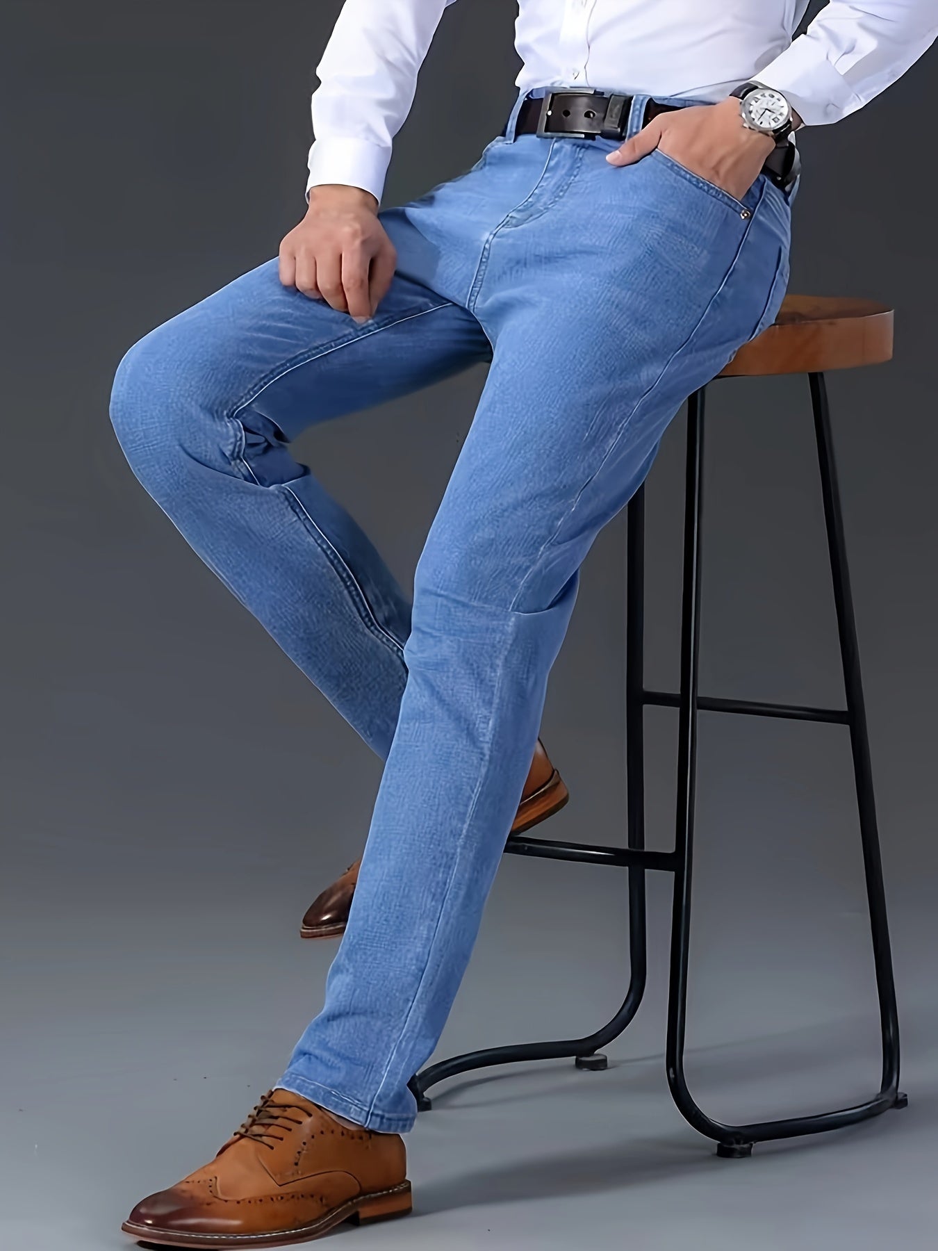 Casual solid denim pants for men with pockets, made from a cotton blend for outdoor activities.