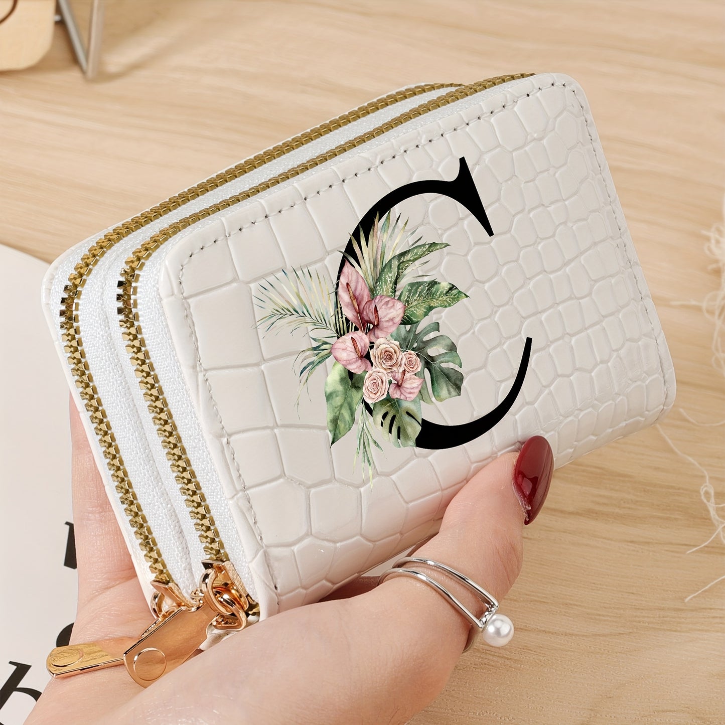 Women's credit card wallet with elegant floral letter print in black & white. Features large capacity, dual zipper, crocodile texture PU, lightweight design with nylon lining for everyday