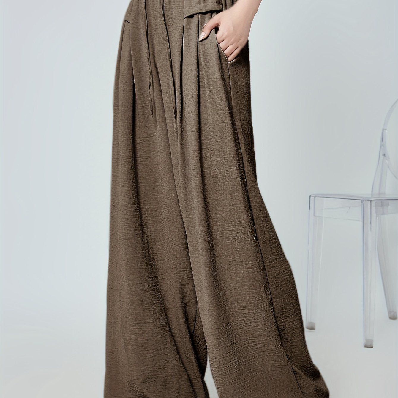 Stylish lounge bottoms with elastic drawstring, pleated detail, and wide leg fit for women's loungewear.