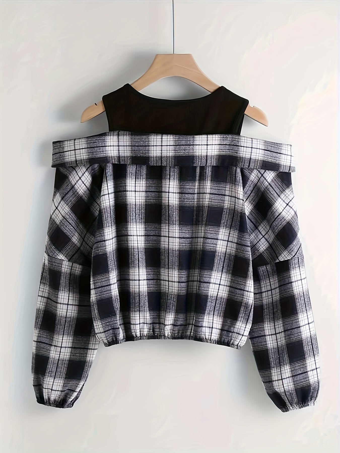 Cold shoulder plaid print blouse with long sleeves and quarter zip, suitable for spring and fall.