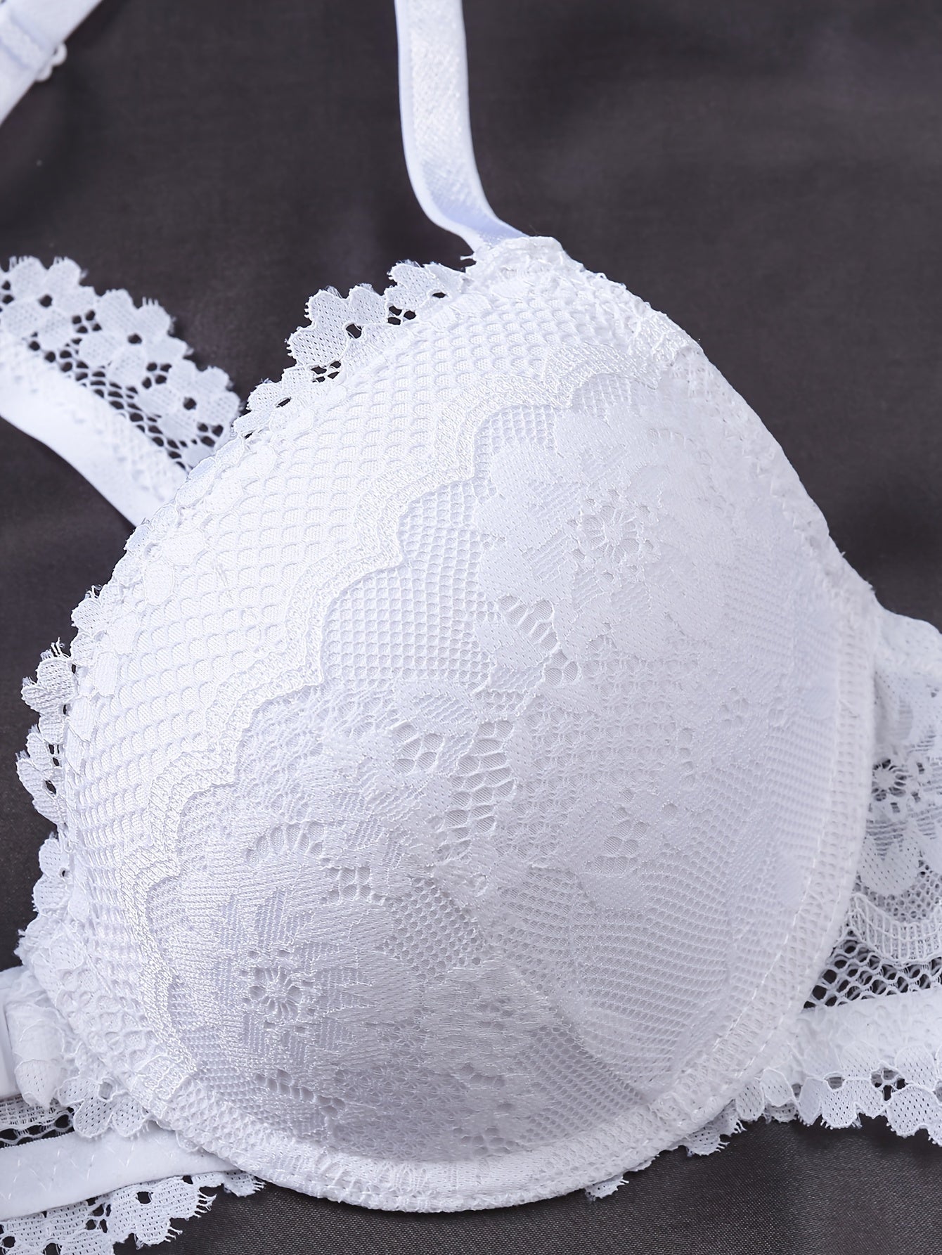 Women's lace underwire bra made of 90% polyamide, 10% elastane with non-removable padding and contrast lace detail.