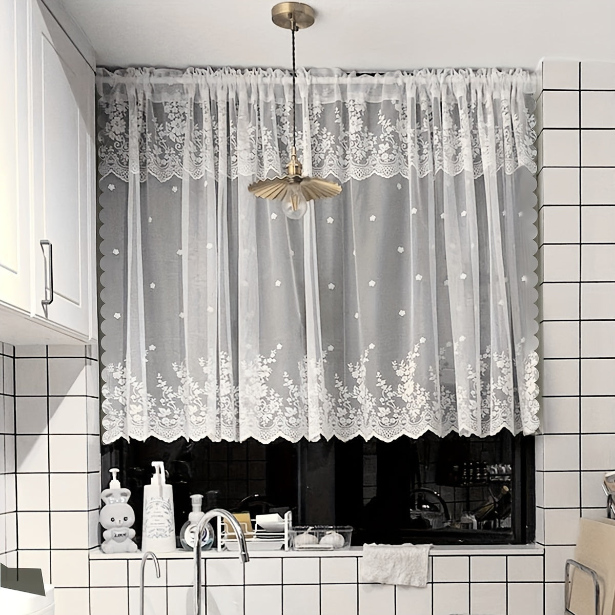 Add a touch of charm to your living space with this lovely White Floral Lace Curtain featuring a Sweet Garden Style. The Rod Pocket Design makes hanging a breeze, making it perfect for windows and doors in the living room, bedroom, or kitchen. Made of