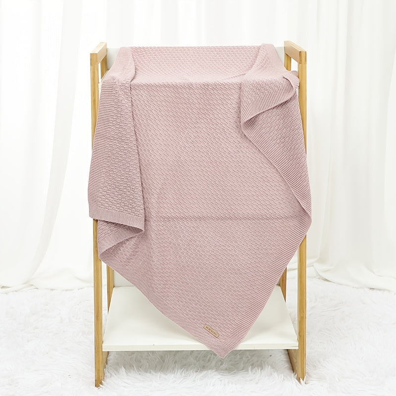 Dreamwrap is an ultra-soft knit blanket designed for youngsters. This solid color blanket is perfect for use in cribs and strollers. It is recommended to hand wash only. Available colors include gray, white, and pink.