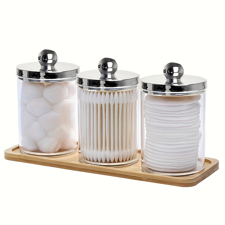 3-piece Qtip holder with tray, acrylic apothecary jars and lids for bathroom storage.