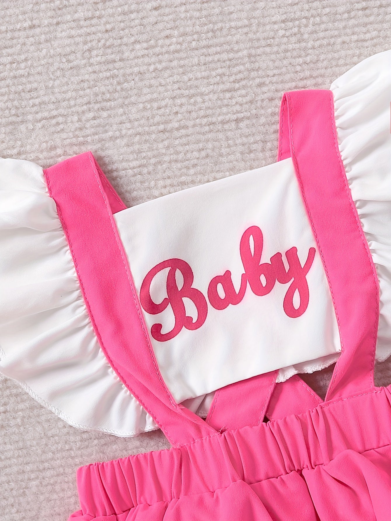 Sweet baby romper dress with cute color contrast letter print and flying sleeves.