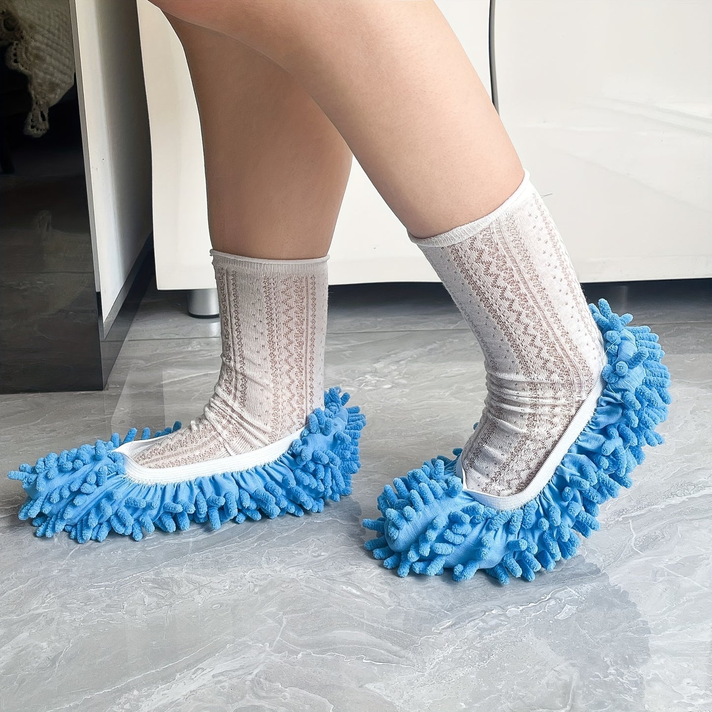 1 pair of blue and white lace patterned plush chenille mop slipper covers made of 100% polyester, machine washable for easy floor cleaning and home comfort.