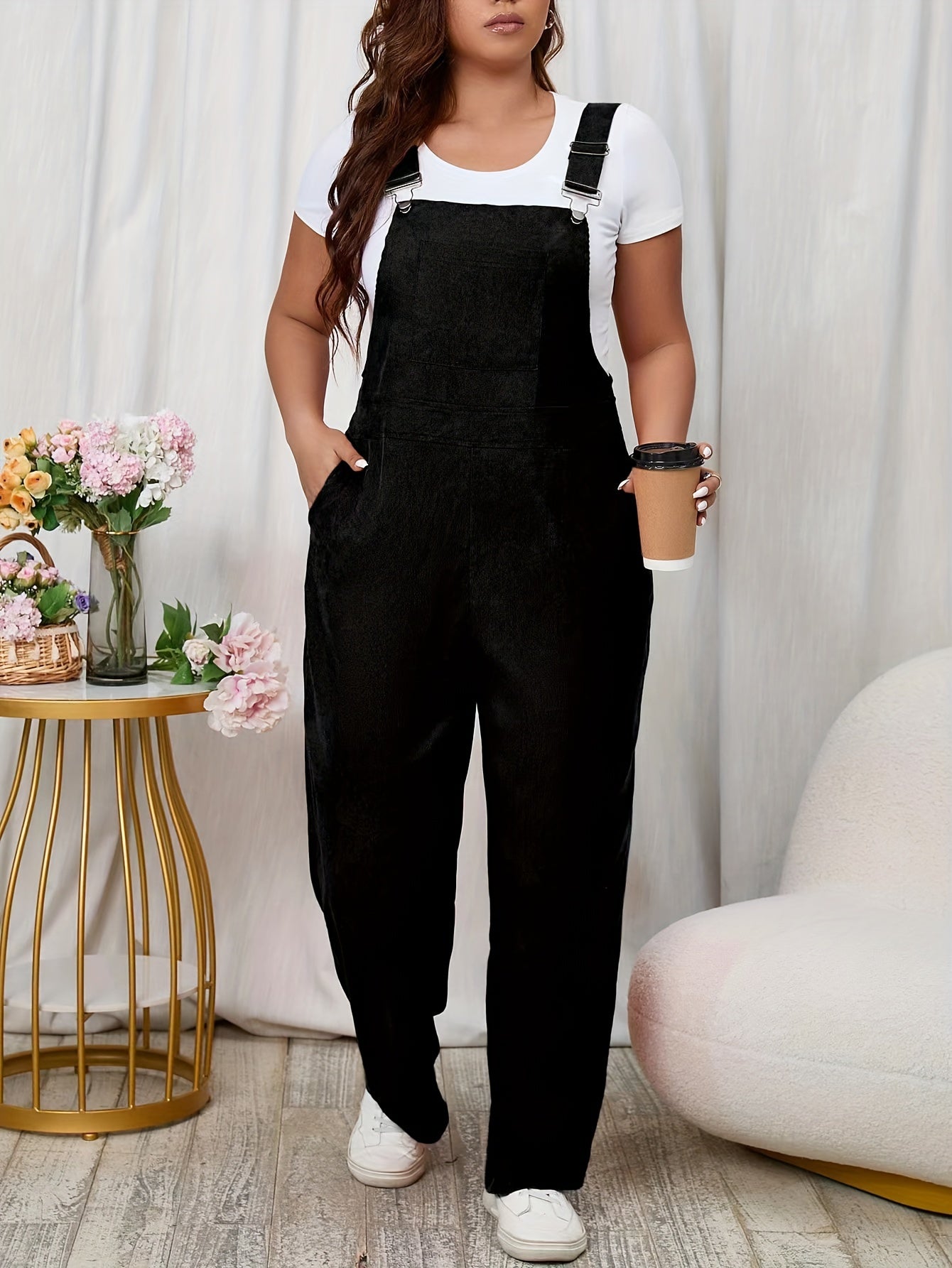 Sleeveless solid buckle jumpsuit for plus-size women with pockets.