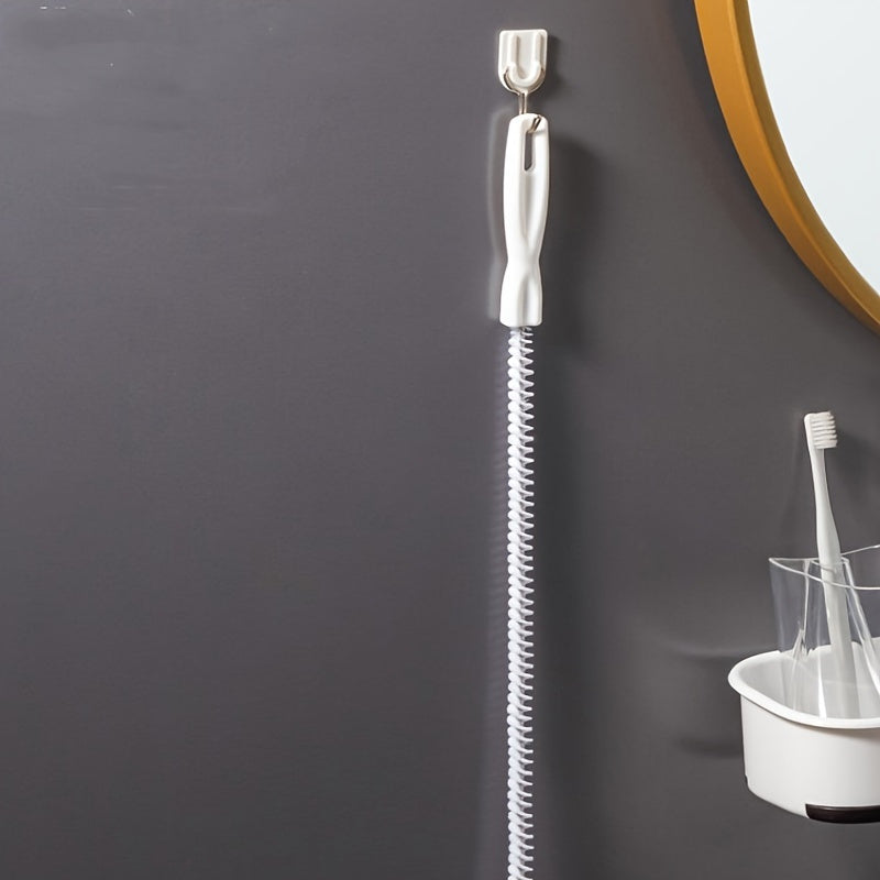 Non-electric, manual unclogging brush for flexible pipes in the bathroom.