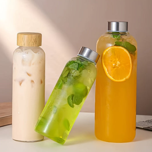 This borosilicate glass bottle comes with both a stainless steel lid and a wooden bamboo lid, making it perfect for travel and storing a variety of beverages such as juice, smoothies, kombucha, kefir, and tea. It is 100% leakproof and can be safely used