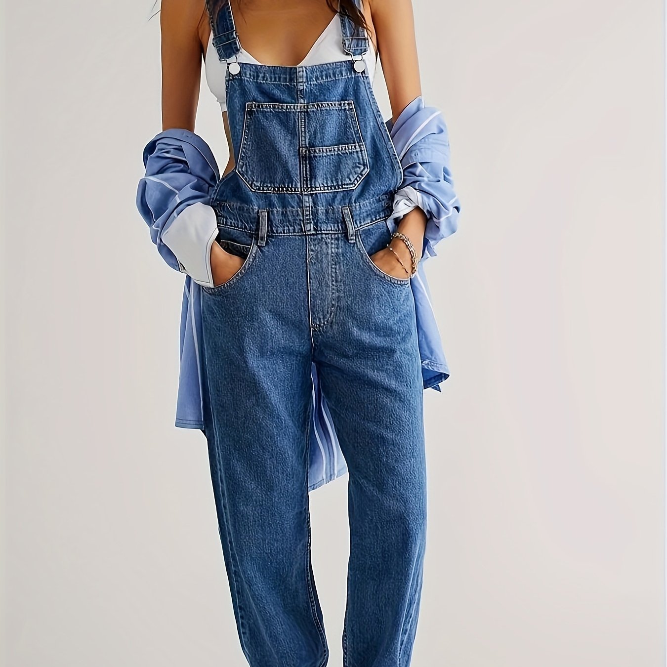 Casual solid color denim overalls for women, made of viscose and polyester blend fabric, strappy back design, no belt included, regular fit.