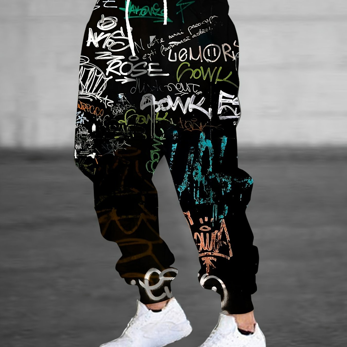 Men's polyester sweatpants with 3D graffiti print, drawstring, pockets, slight stretch, regular fit joggers.