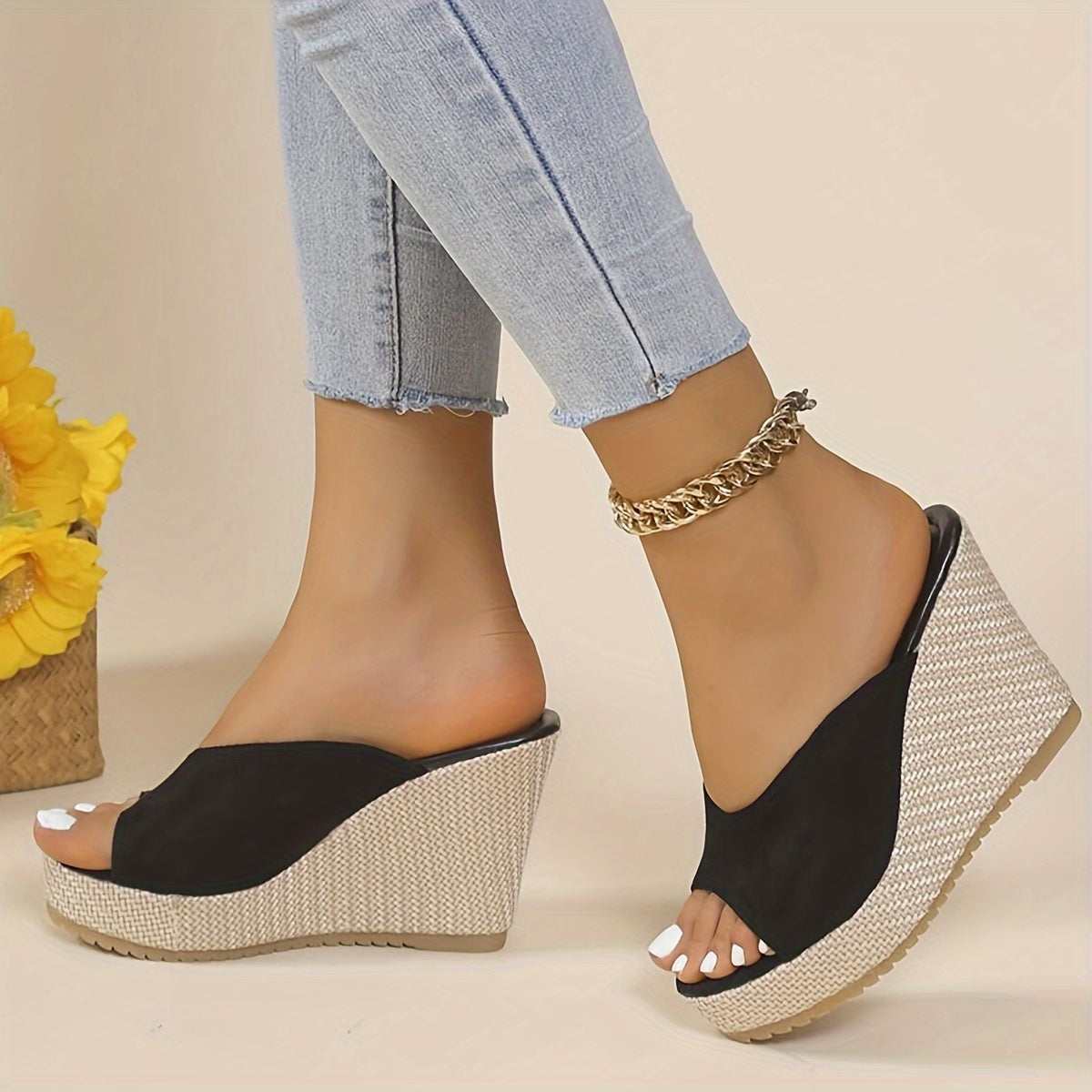 Black slip-on wedge sandals for women with an open toe, high heel, comfortable ankle strap, and woven design sole - perfect for casual summer wear.