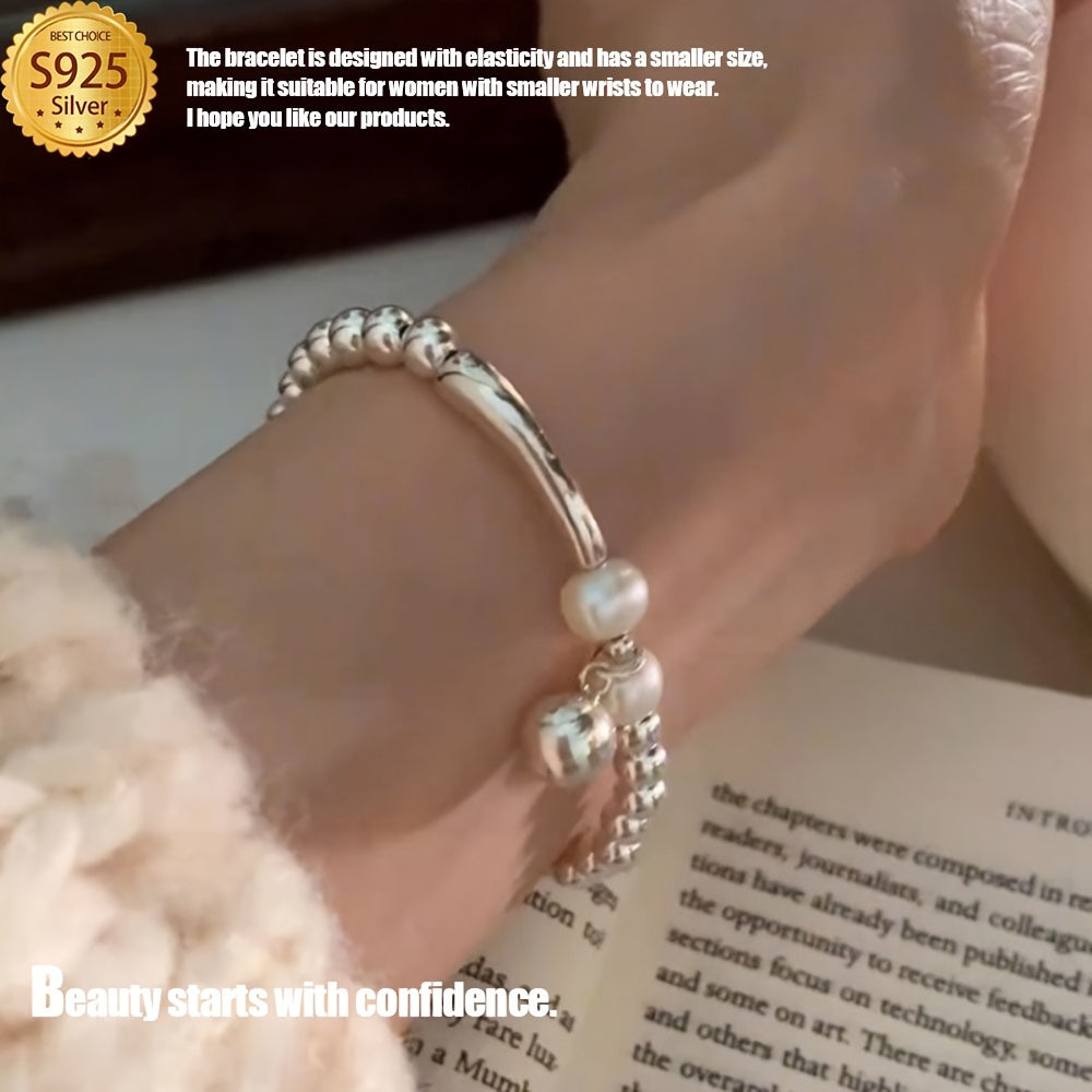 This Elegant Silvery Bracelet features embedded pearls, exuding luxury and sophistication. With a high-end and unique design, it is cool, refreshing, and perfect for those seeking individuality. This exquisite piece is a great gift, guaranteed to bring