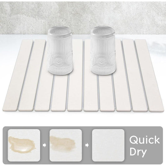 Get your hands on the 1pc Diatom Mud Dish Drying Mat, a collapsible and quick dry countertop pad measuring 60.96cm x 40.64cm. This large absorbent stone mat is perfect for drying dishes, bottles, and cups, and fits seamlessly on any kitchen counter.