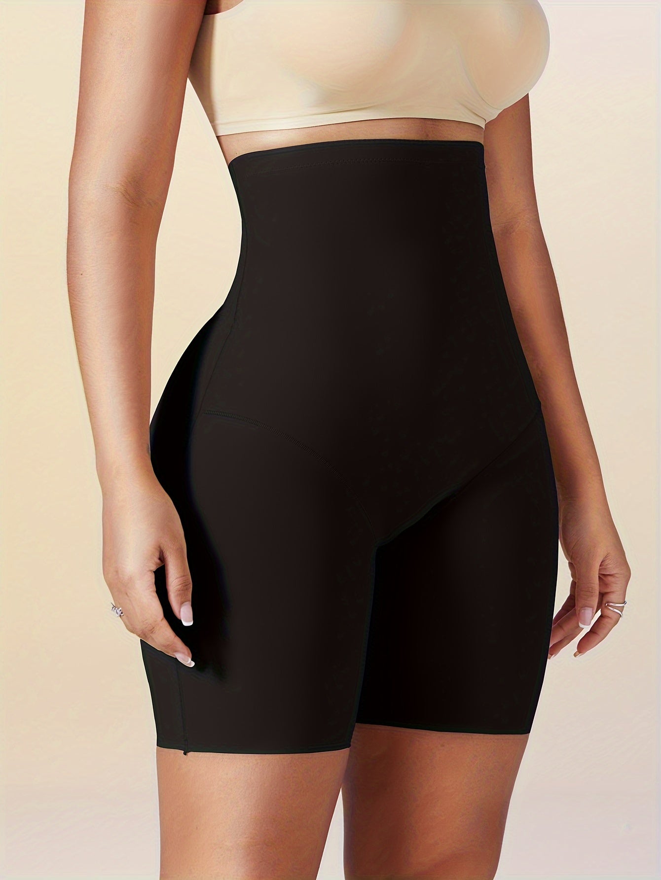 Seamless high-waist shapewear shorts for women with tummy control, ideal for slimming and enhancing body shape under dresses.