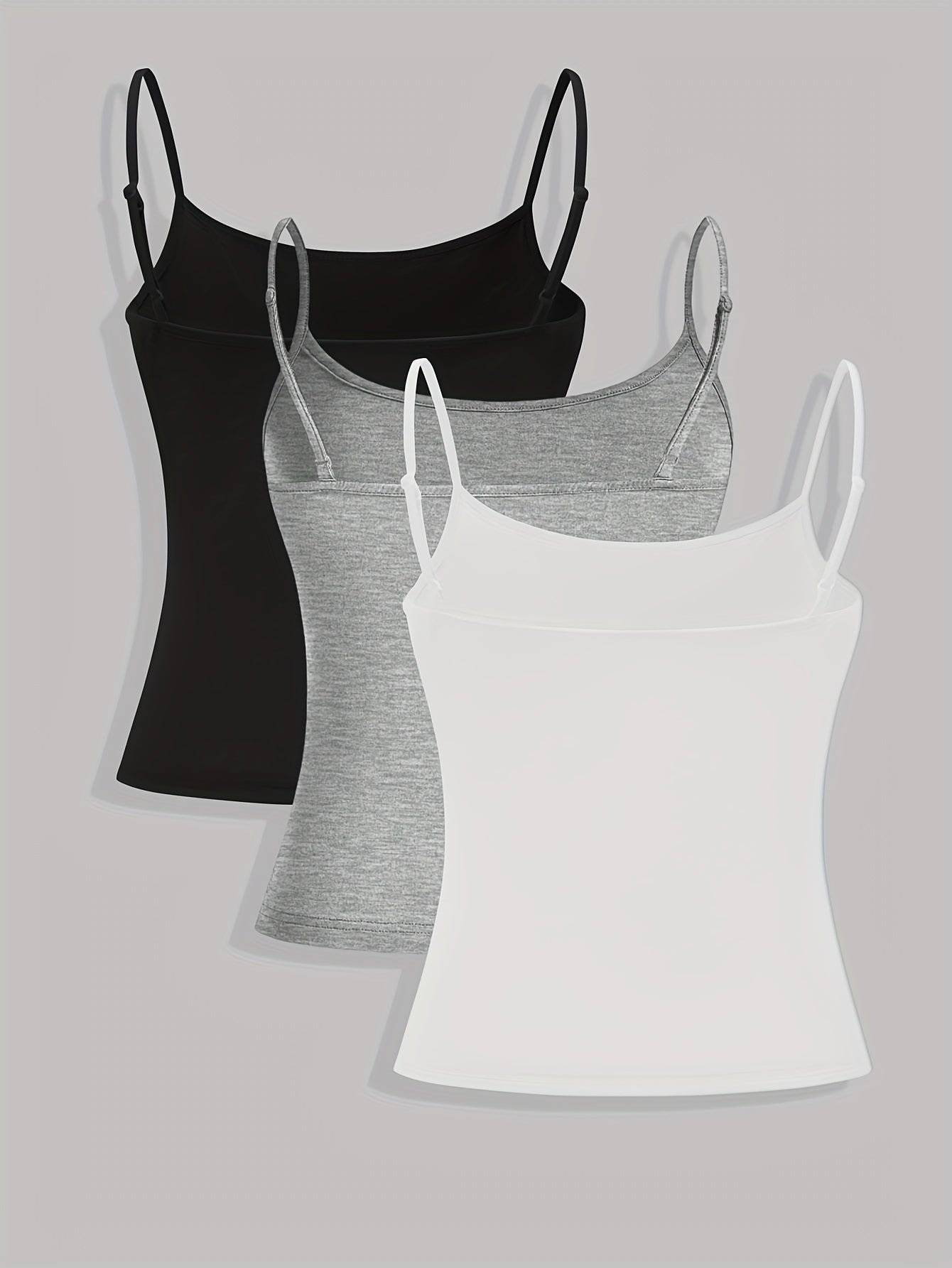 Three solid color women's camisole tank tops.