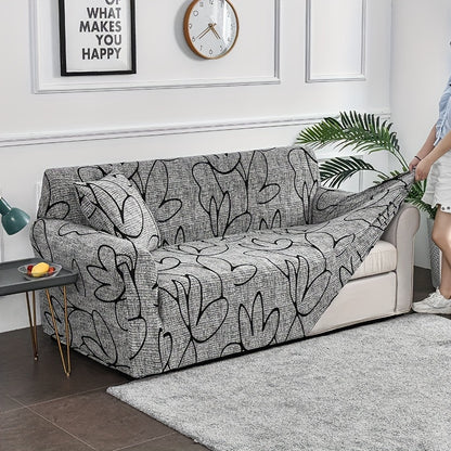 Elastic leaf-printed sofa slipcover for non-slip protection and decor in the living room.