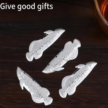 1 piece of silvery tea ceremony accessories for making tea and boiling water, a silvery dragon fish tea pet, and a silvery leaf for sterilizing and softening water quality.