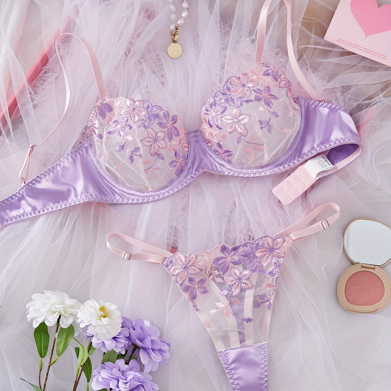 Women's sexy lingerie set featuring a flower design bra and thong.