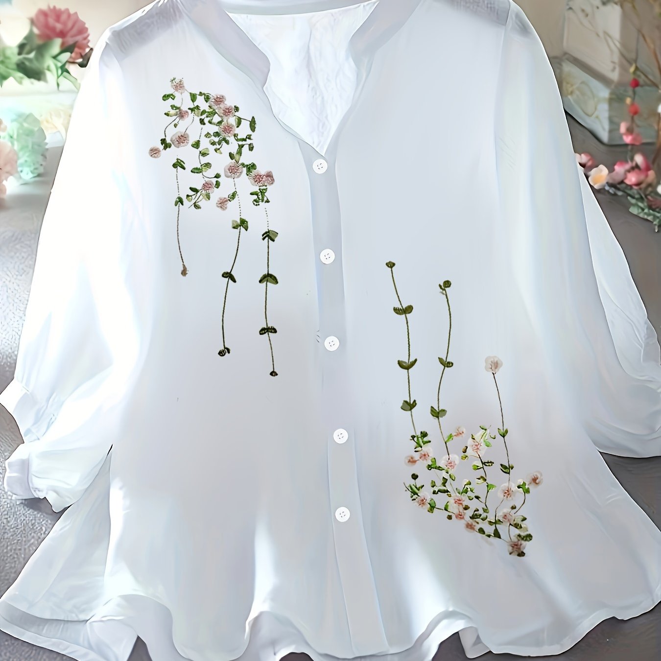 Floral pattern blouse with button front and stand collar