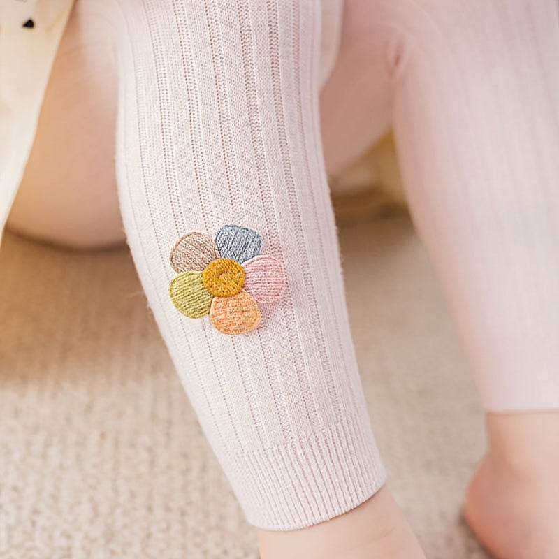 Girls slim legging pants with rib knit flower doll design, made of cotton blend stretch fabric for a tight fit.