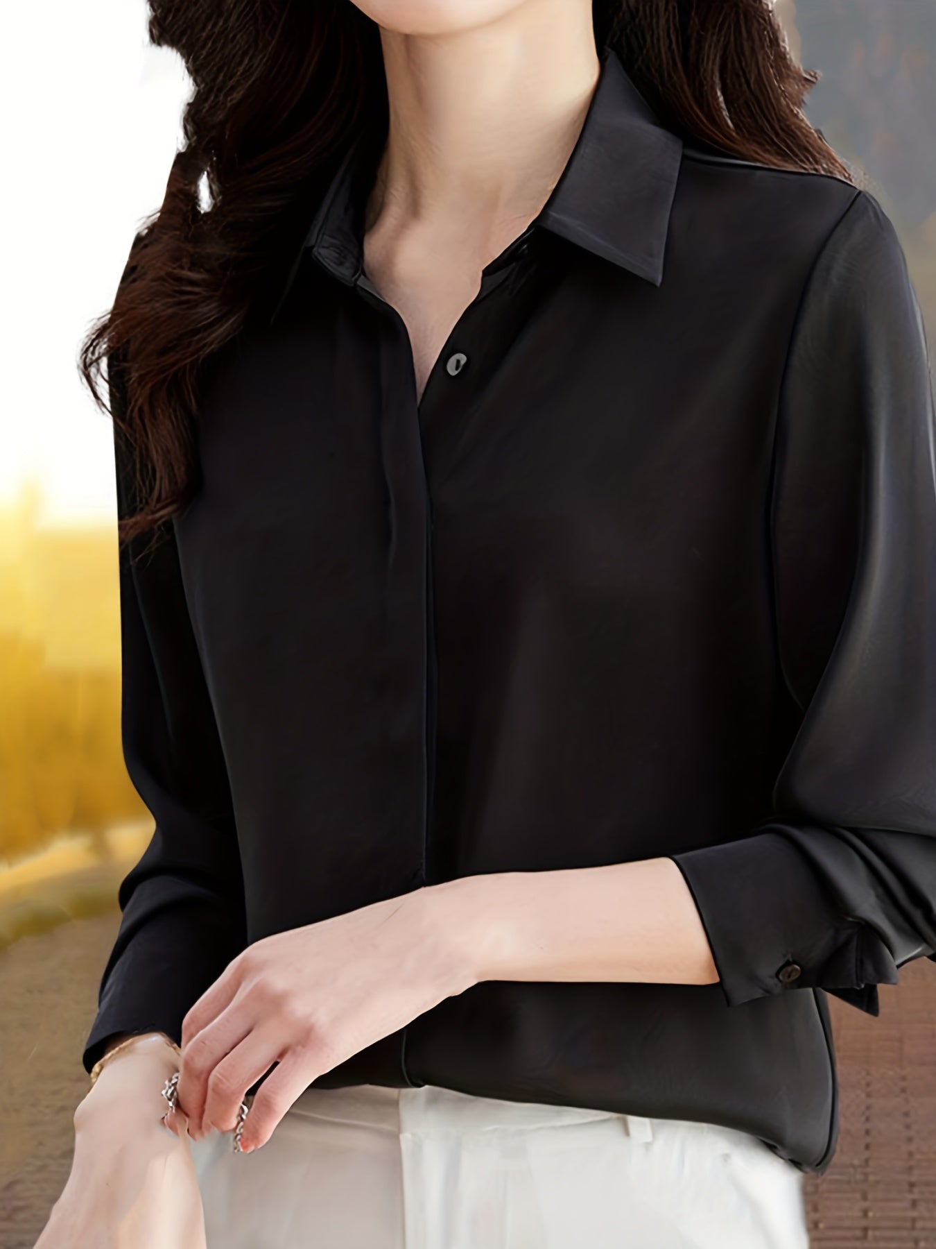 Elegant black long sleeve shirt for women, perfect for all seasons made of non-stretch polyester fabric.