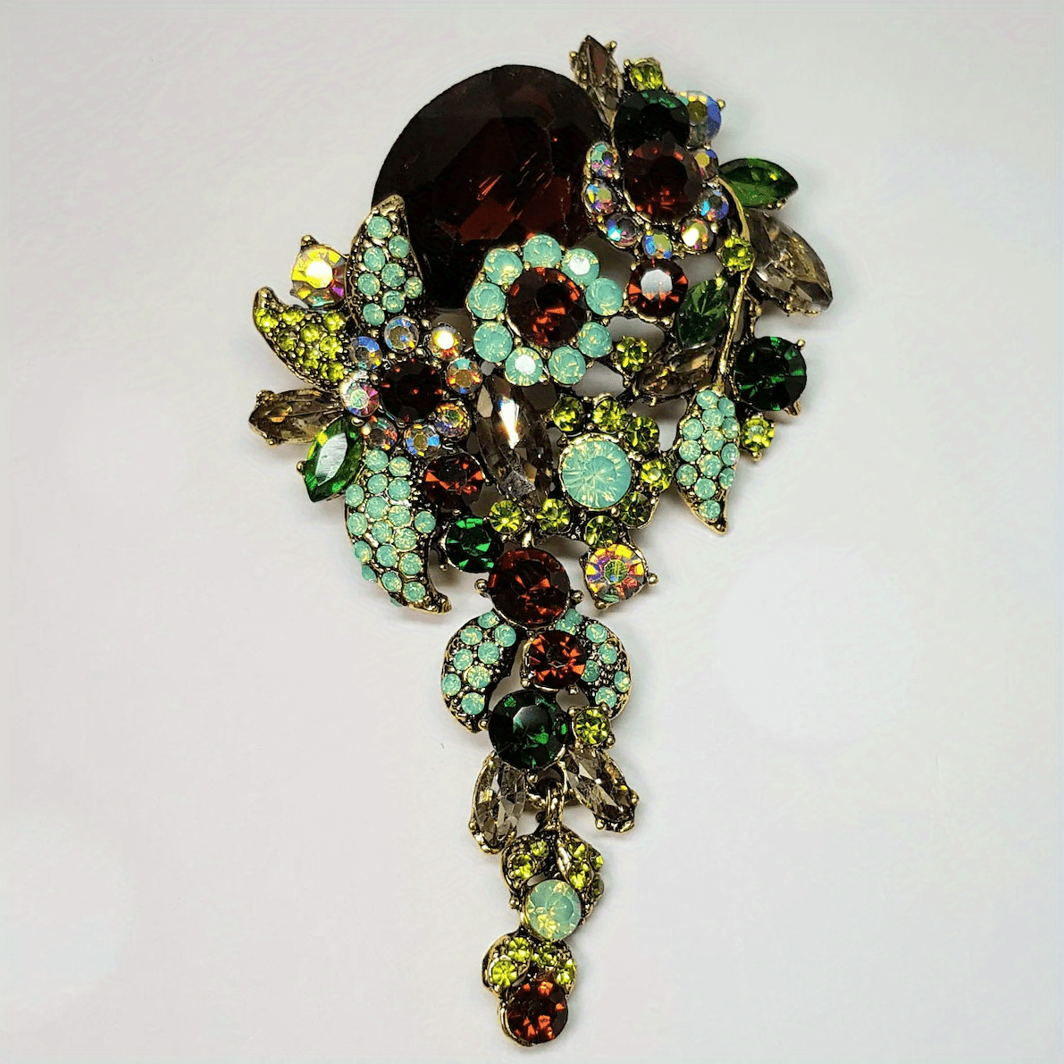 Beautiful antique-style brooch embellished with shimmering brown and green crystals - made of durable alloy, perfect for a one-of-a-kind gift suggestion.