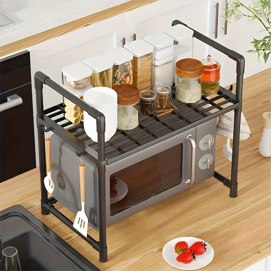 Expand your kitchen space with this 1pc Expandable Carbon Steel Microwave Oven Rack. This 2-Tier Countertop Organizer is perfect for storing kitchen utensils and tableware. With its sleek design and open storage, it is an ideal gift for Mother's Day.