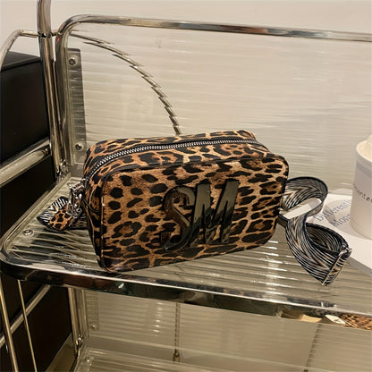 Leopard print PU crossbody bag with detachable strap in deep brown, perfect for casual or commuting outfits. Bold letter design on small shoulder bag.