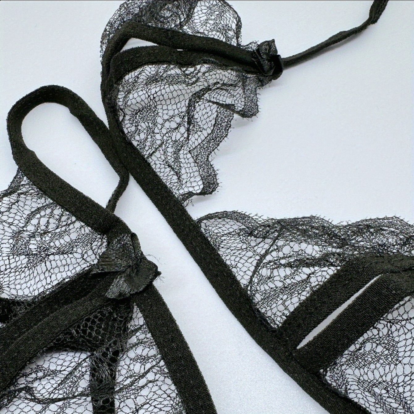 Seductive lace lingerie set with exposed breast design.