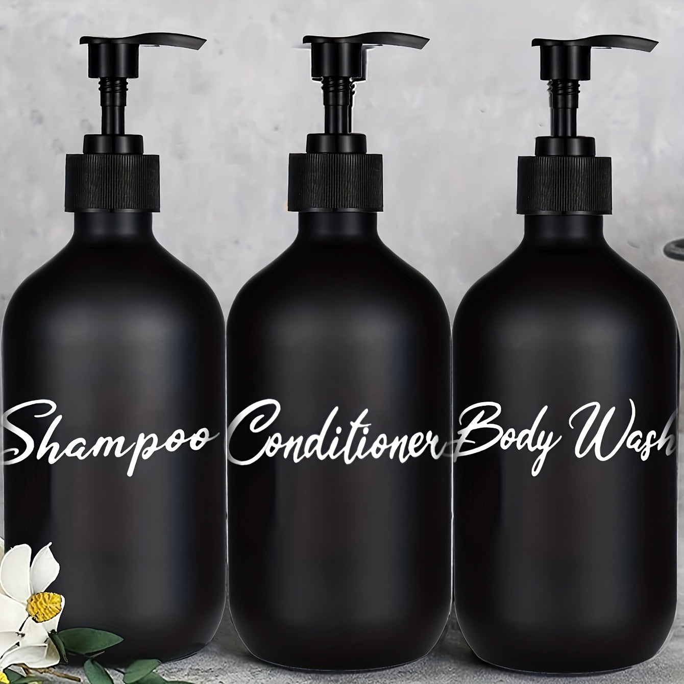 3 black soap dispensers for bathroom shower products, refillable liquid storage containers.