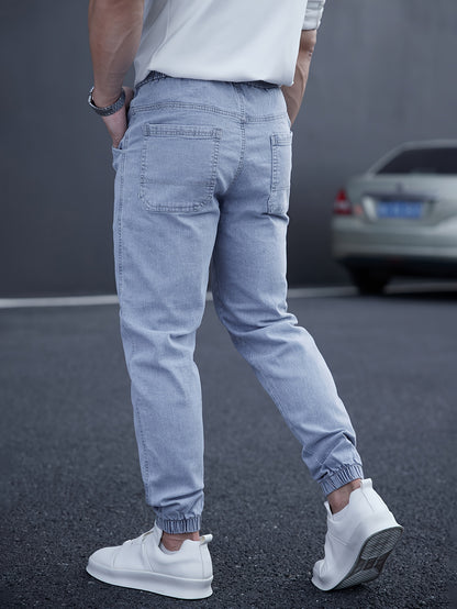 Trendy men's tapered jeans with waist drawstring