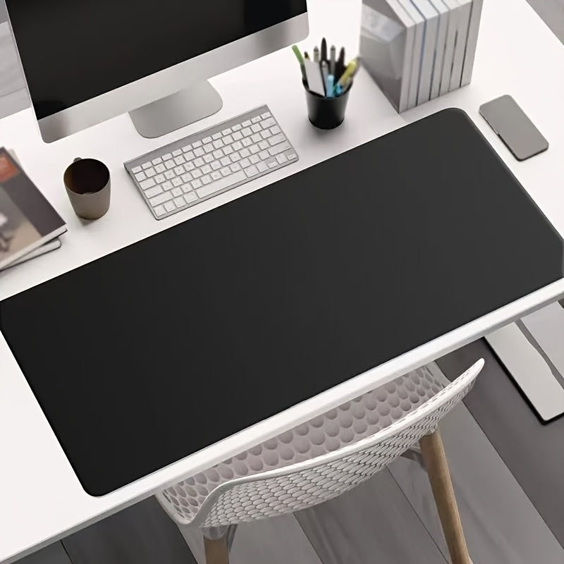 Black non-slip desk mat for office, ideal for computer and mouse.