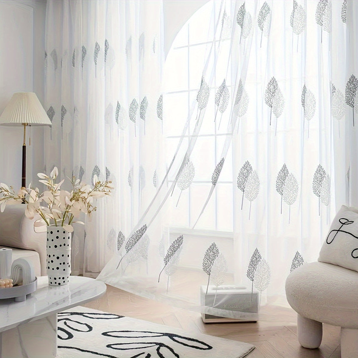 Add a touch of pastoral elegance to your home with this beautiful sheer curtain featuring delicate leaf embroidery. This translucent tulle curtain is easy to hang with a rod pocket design, perfect for adding a subtle touch of style to your living room or