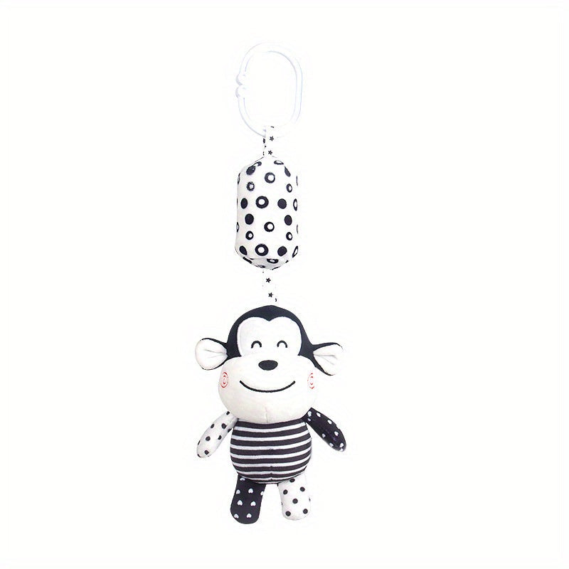 Black and white rattle wind chime for visual training in babies, perfect for early education and development. Makes a great gift for babies and toddlers.