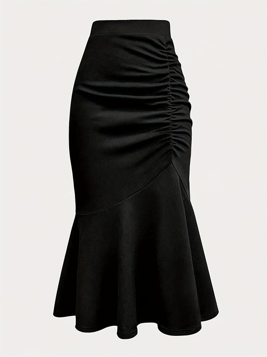 Elegant black mermaid skirt with ruffled hem for all occasions. Made of polyester knit fabric.