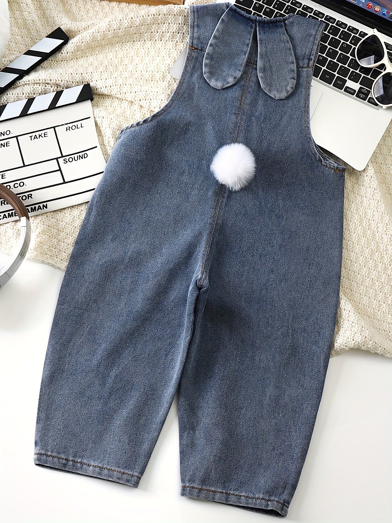 Adorable light blue denim overalls for kids with rabbit ear details. Casual, loose fit for spring & autumn. Machine washable, perfect for outdoor activities.