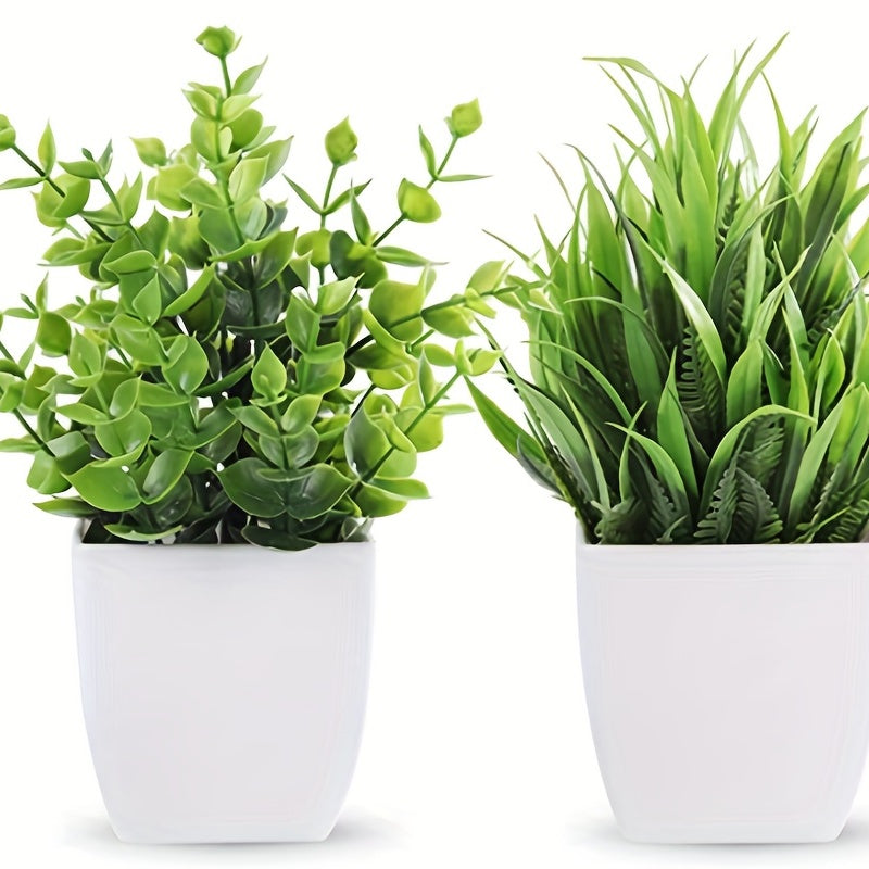 2 artificial mini potted plants with green eucalyptus leaves for summer home or desk decor.