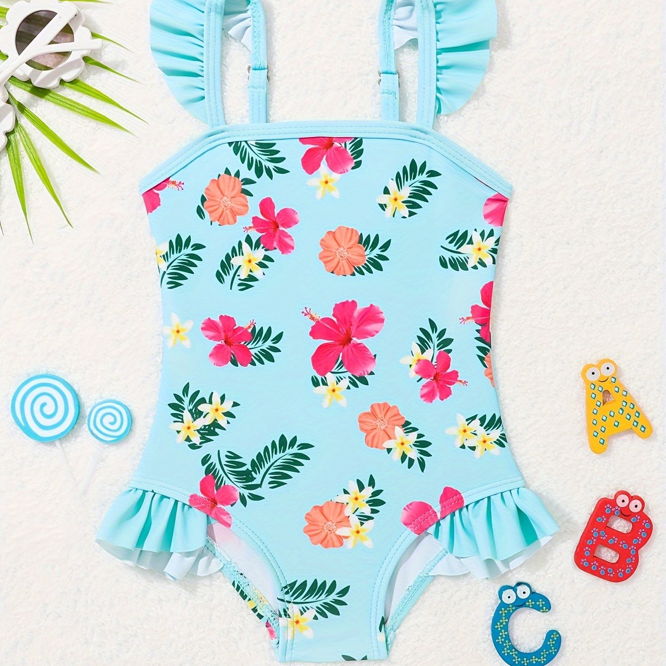 Adorable pineapple pattern one-piece girls' swimsuit in quick-dry, stretchy polyester with ruffle detail, off-shoulder design for toddlers.