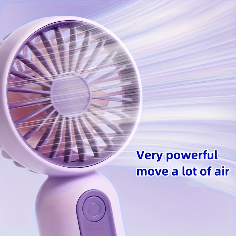 Small portable fan that is handheld and rechargeable via USB, light weight and quiet for use on desk or while traveling, ideal gift for the summer season.