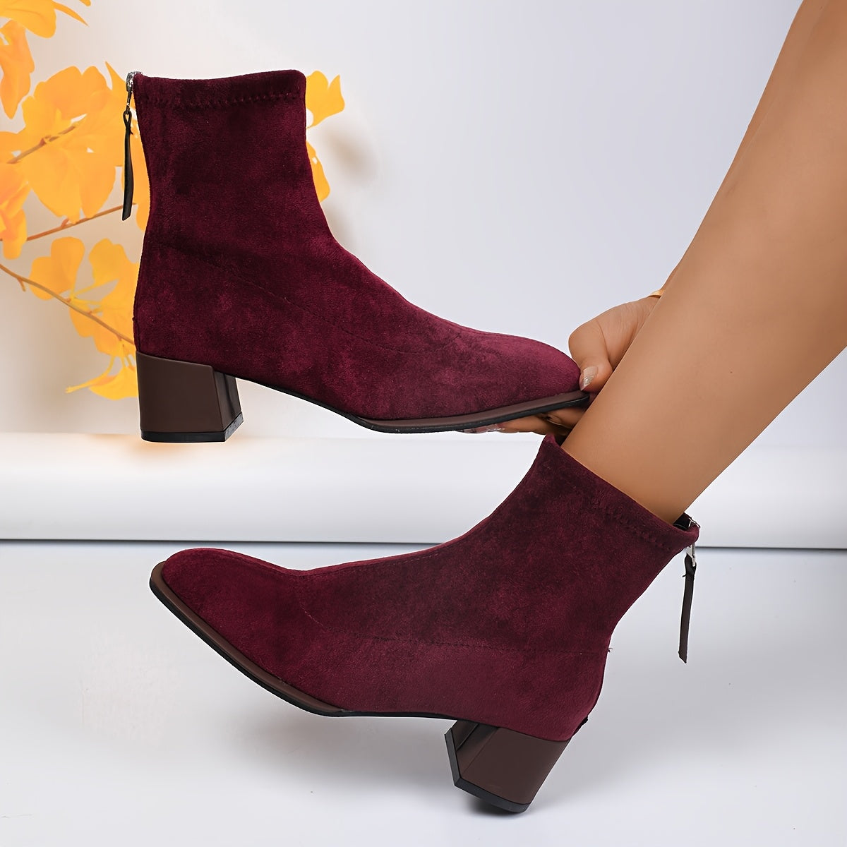 Elegant ankle booties for women with square toe, flannel upper, rubber sole, block heel, and zipper closure - ideal for fall season comfort.