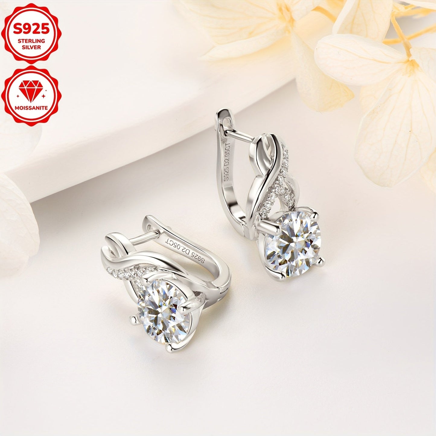 Get yourself a stunning pair of Moissanite earrings designed for women featuring infinite elements. These 925 pure silvery earrings have 8mm round Moissanite stones, perfect for weddings and parties. The earrings weigh about 4.89g and each one showcases