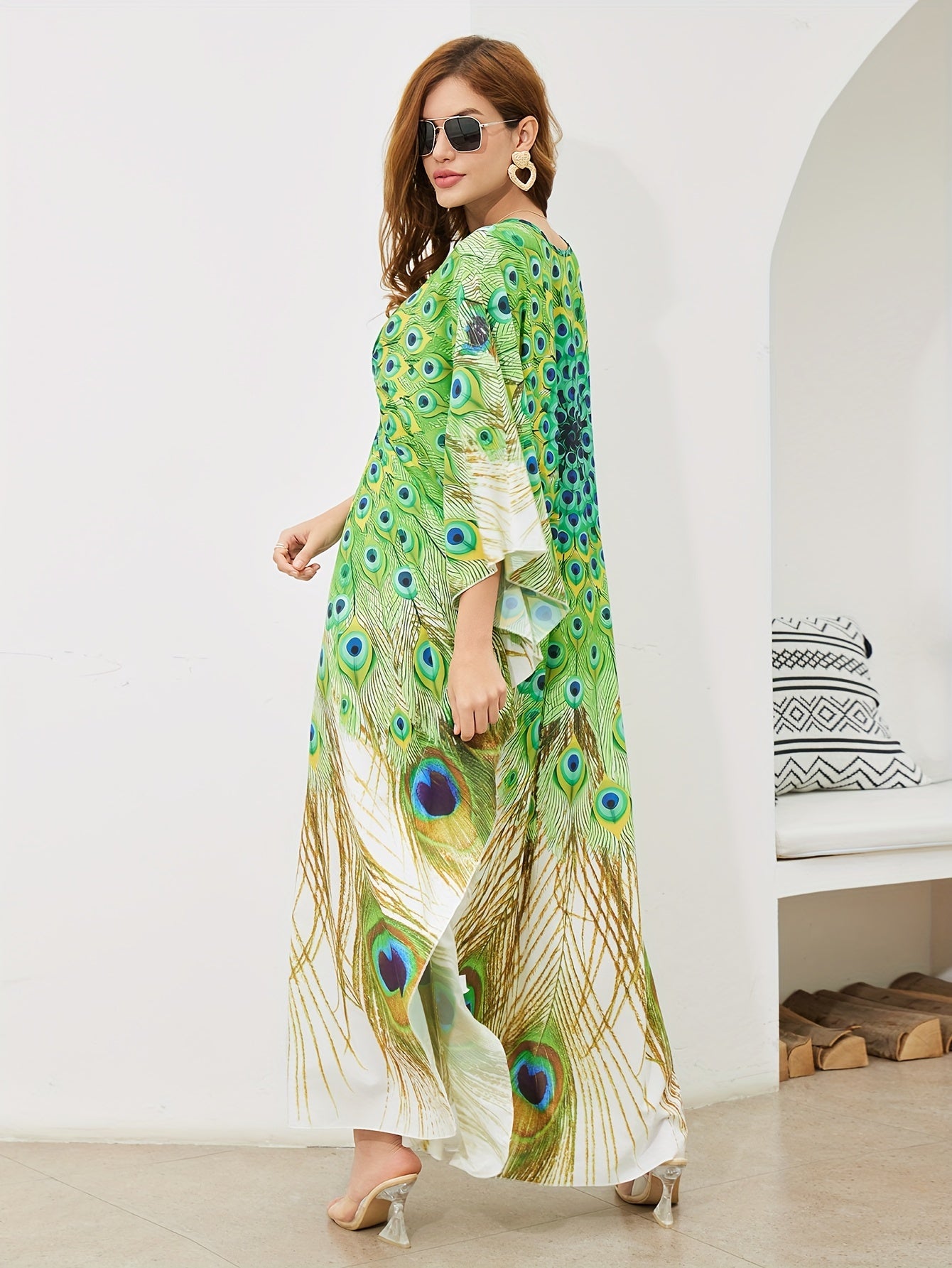 Handmade V-neck maxi beach dress in vibrant green, yellow, and blue peacock print, perfect cover-up for swimwear.