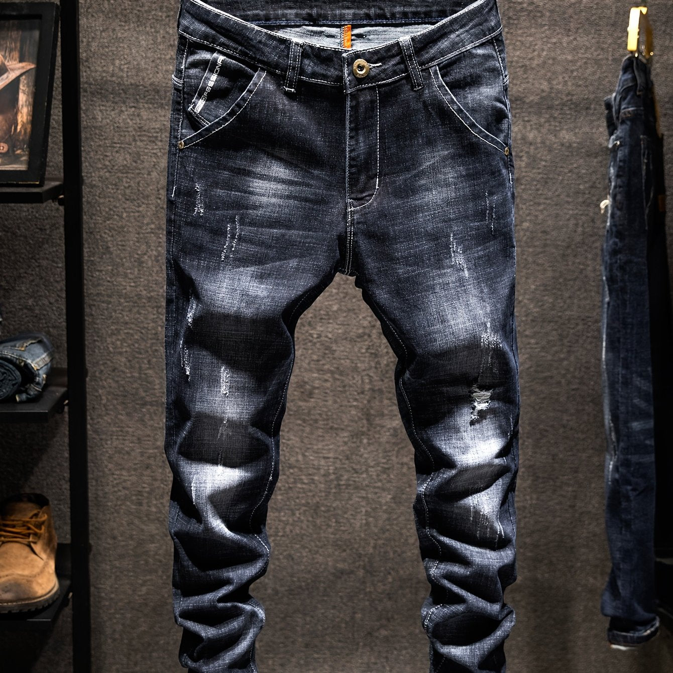 Men's Distressed Ripped Jeans in Regular Fit, made with 74.70% Cotton, 23.70% Polyester, and 1.60% Elastane. Solid color, all-season wear with slight stretch and washed finish. Woven fabric